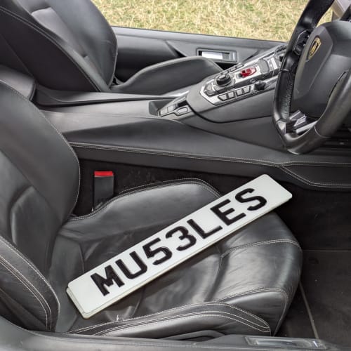 A close-up of a car number plate