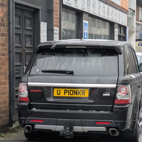 A close-up of a car number plate