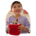 Young boy with brown hair happily playing with red Toniebox 2 and Lion King character.