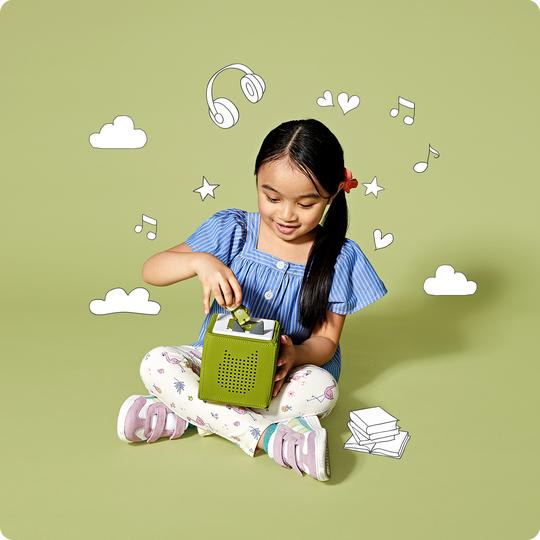 Girl with green toniebox