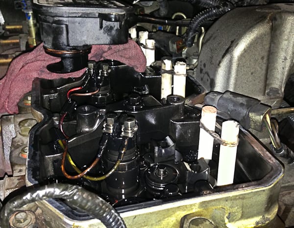 Valve train on Cummins Diesel. The wooden "pushrods" are a tool to hold up the tappets while the camshaft is removed. Another thoughtful repair procedure courtesy of Cummins.