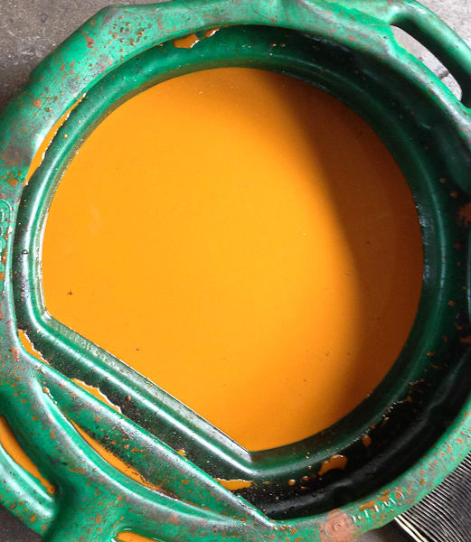 A bucket full of rusty coolant. Even after an hour of power flushing there is still rusty residue in the cooling system