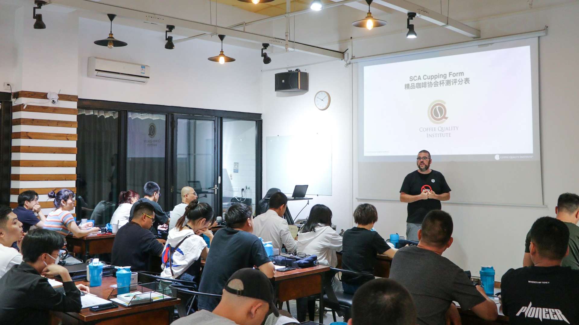 Torch Coffee training session with students learning coffee preparation
