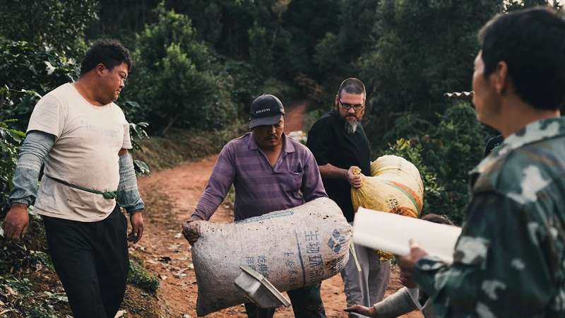 Marty and Dr. Milton Coke discussing coffee's role in connecting communities