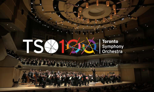 TSO100 logo over TSO performing in Roy Thomson Hall