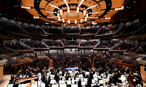 Roy Thomson Hall, fully list, with a full audience and the orchestra on stage at the TSO100 Open House