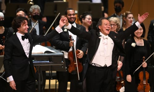 Gustavo Gimeno and Yo-Yo Ma, with hands together, taking a bow 