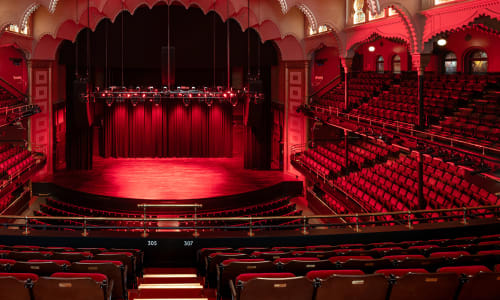 Interior of Massey Hall, empty and lit up in red
