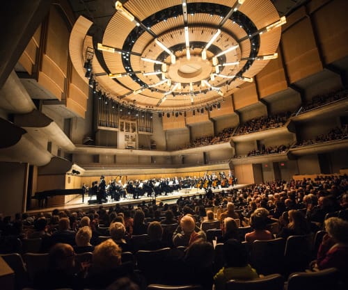 Roy Thomson Hall interior with a full audience and TSO on stage