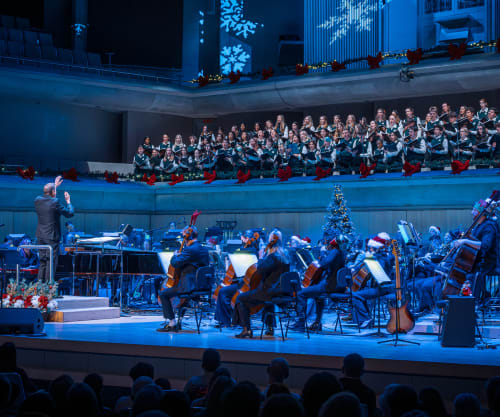 TSO performing on stage decorated for the holidays