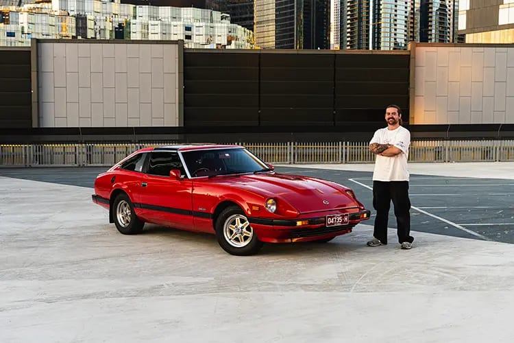 Jackson Fryer standing next to his 1982 Nissan 280ZX
