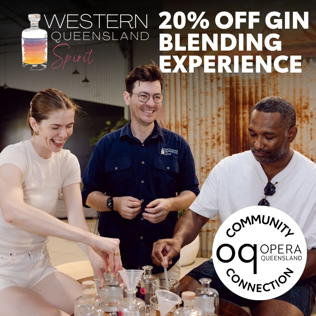 Three people are smiling and enjoying a gin blending activity at a distillery. On the left, a woman in a white top is laughing while working with glass bottles and funnels. In the middle, a man in glasses and a navy blue shirt with the Western Queensland Spirit logo looks on, smiling. On the right, a man in a white t-shirt and dark shorts stirs a glass bottle. Various bottles and beakers are spread across the table in front of them. At the top left is the Western Queensland Spirit logo featuring a stylized bottle, and large white text on the right reads: “20% Off Gin Blending Experience.” In the bottom left corner, there is a white circular badge with black text: “Community Connection Opera Queensland.