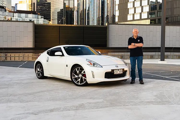 Ron Ray standing next to his 2012 Nissan 370Z