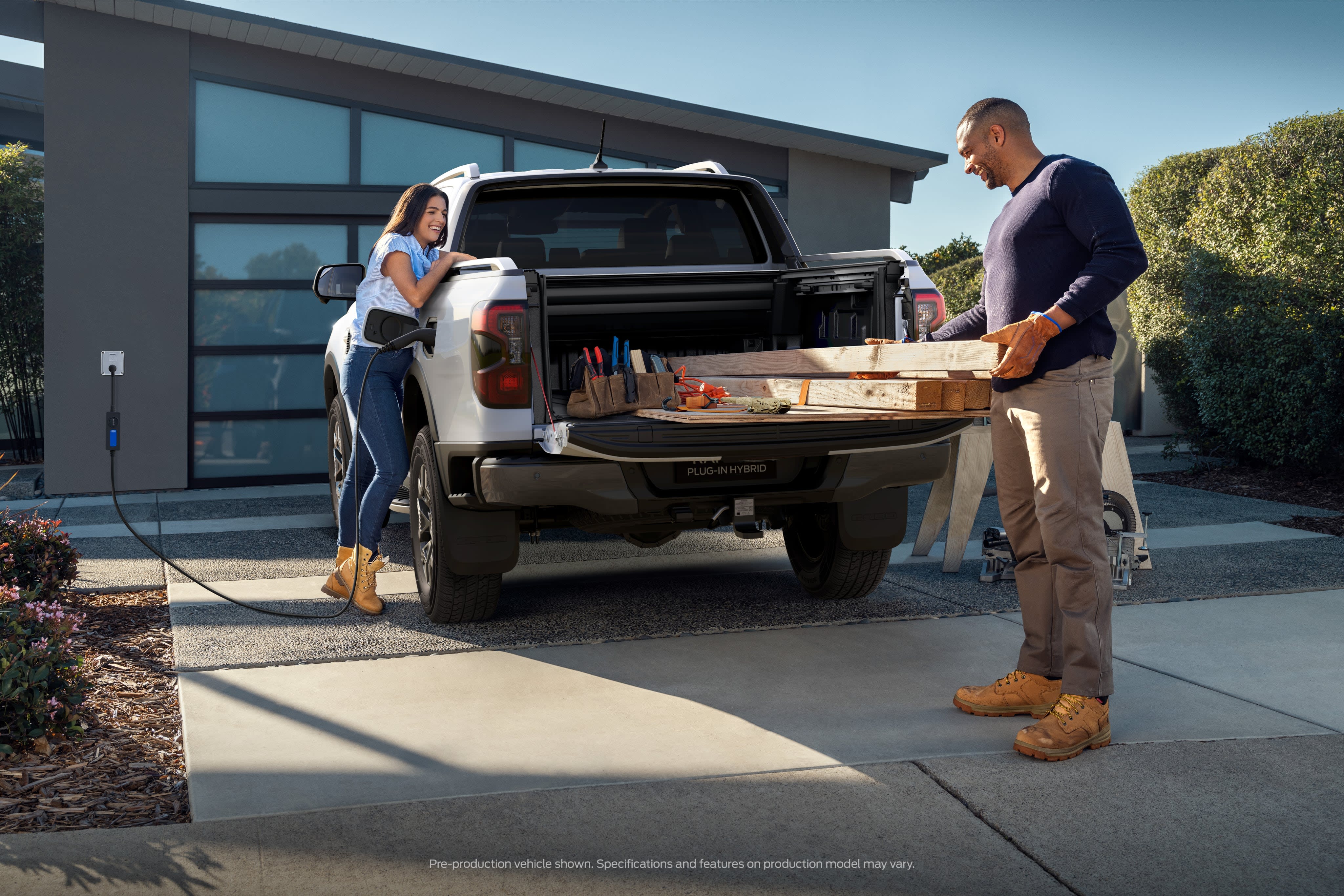 Carpenter working out the back of their Ford Ute.