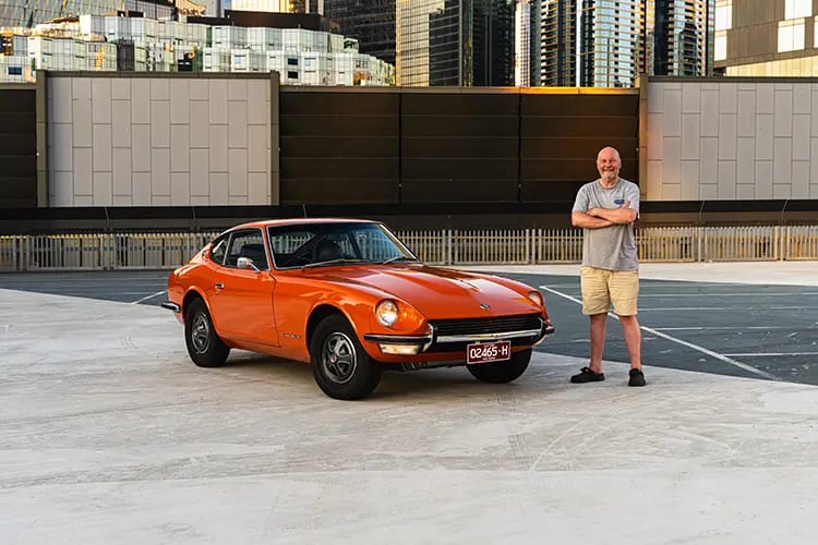Dave Toleman standing next to his 1972 Nissan 240Z 2+0.