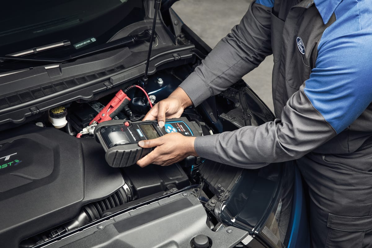Ford service tech working on a vehicle