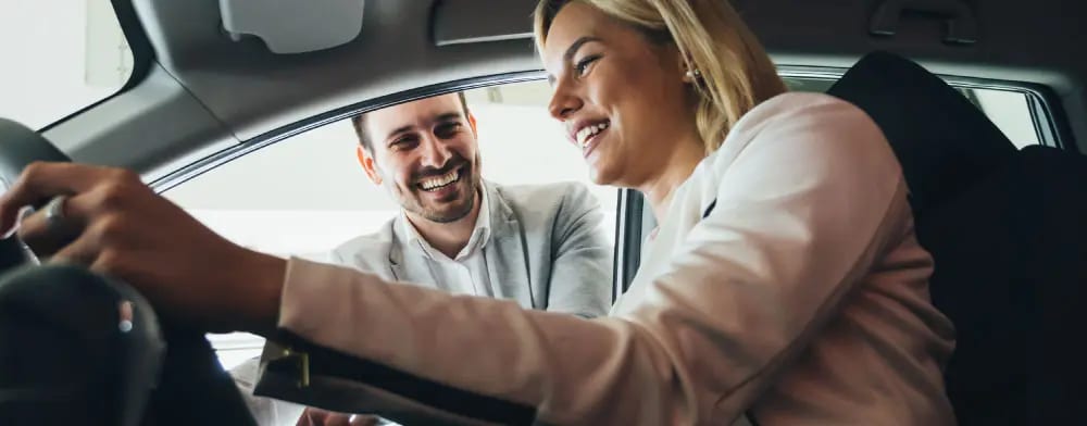 Woman buying new car