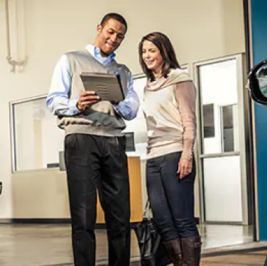 Ford salesperson helping customer
