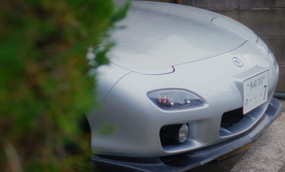 The parking space sits directly in front of the living room. "I love seeing my RX-7 from here," says Naoko. “But not for much longer," she adds with a slightly sad smile.