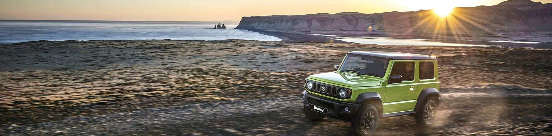 Suzuki driving on beach