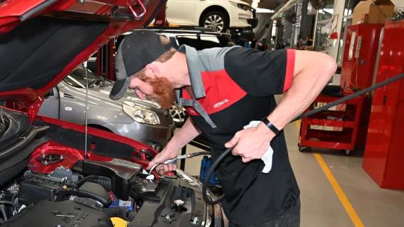 Motorama mechanic servicing a car