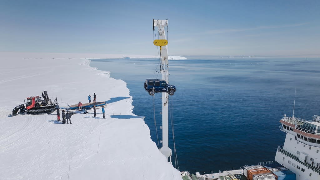 INEOS Grenadier Detour by Arcane Works being craned onto the Antarctic ice shelf