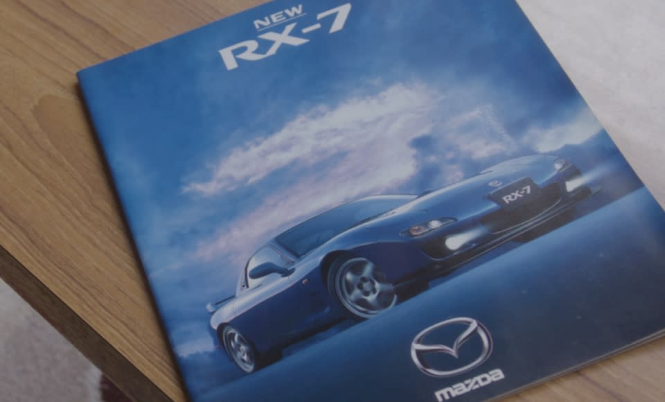 For 25 years, Naoko has carefully preserved the catalogue where she first saw the RX-7. Opening it reveals the blue RX-7 circled with a red pen, a telling sign of how much she wanted the car back then.