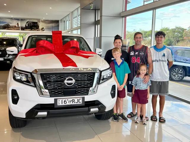 Happy family with Nissan Navara