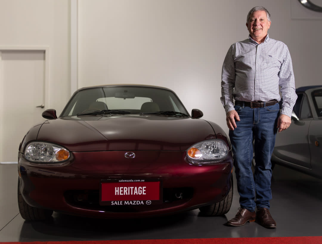 Alan Wilson standing next to the Mazda MX-5 Heritage Edition in Deep Art Vin Red Mica.