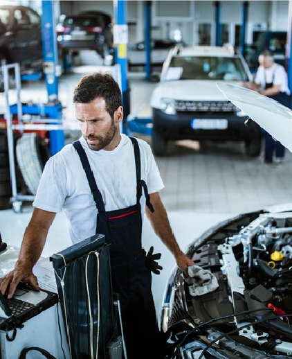 Technician servicing a vehicle in the workshop