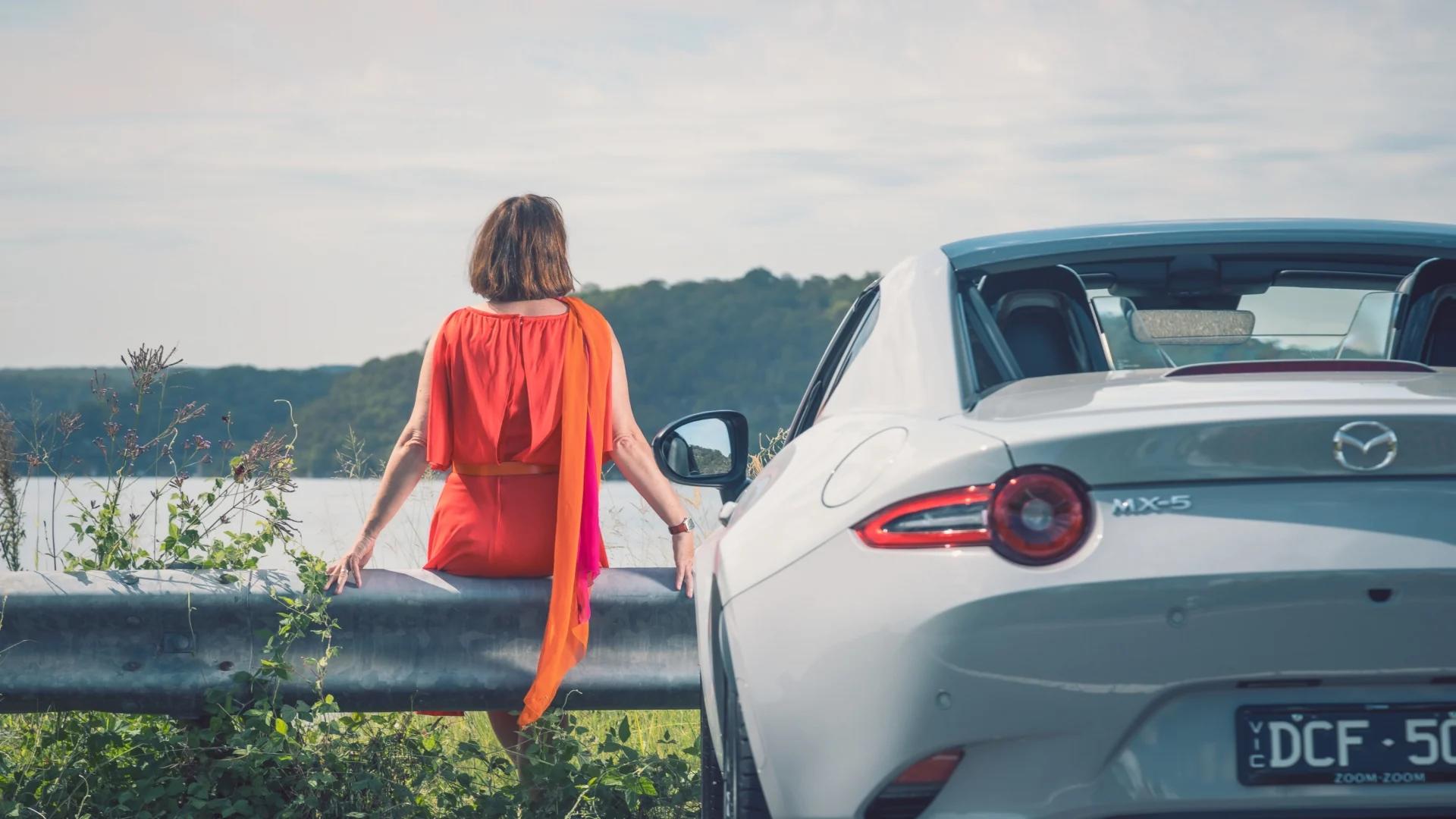 Nikki Gemmell salutes the sun in the MX-5