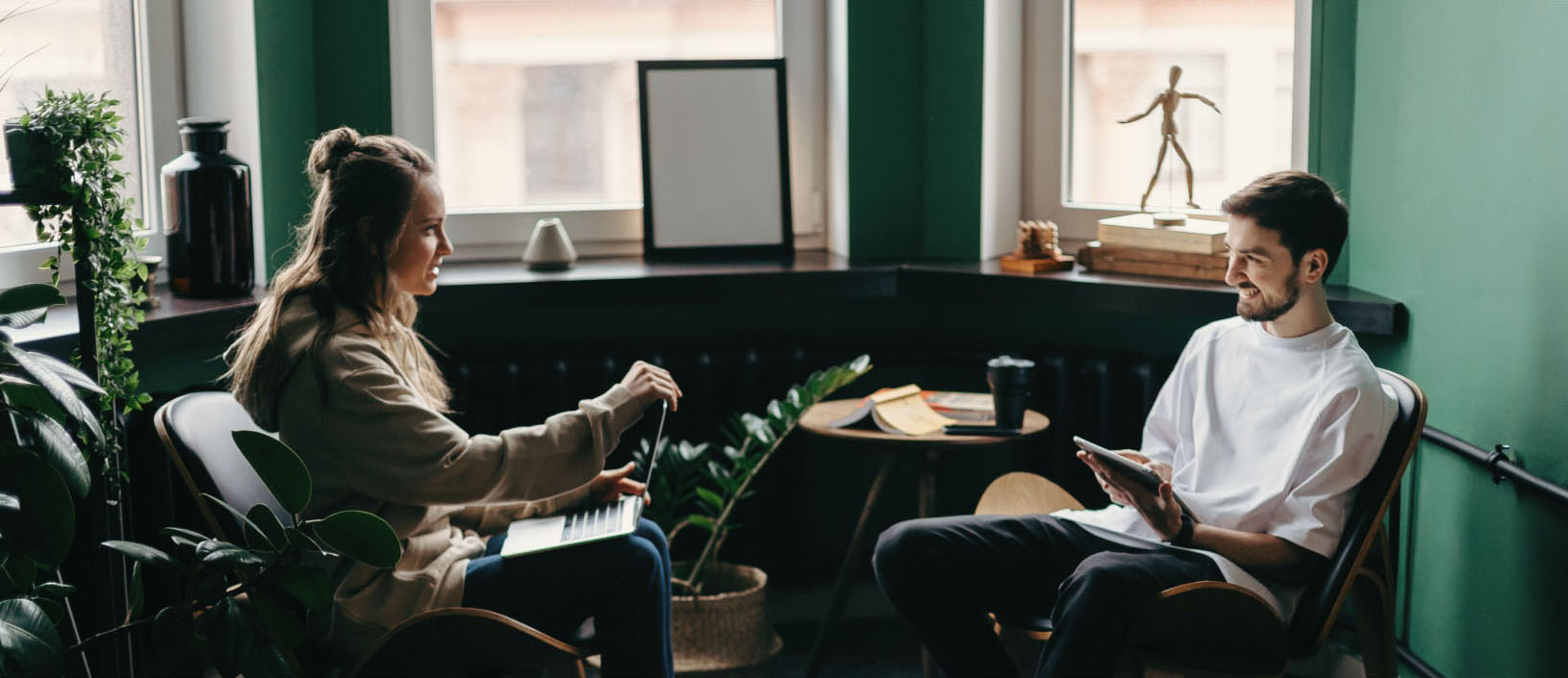 Woman and man on laptop and tablet