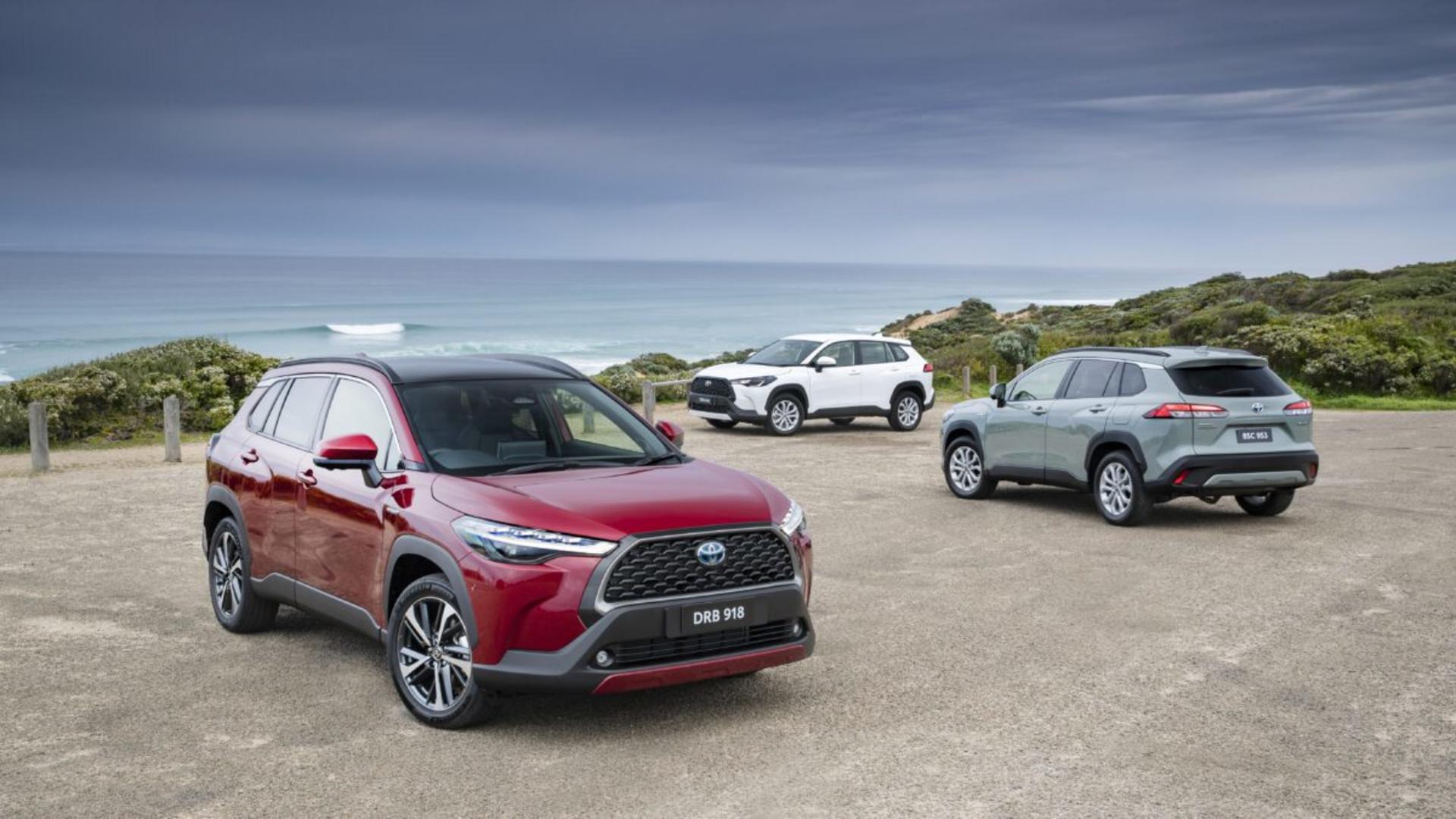 2022 Toyota Corolla Cross Corolla Cross Atmos AWD hybrid (l), Corolla Cross GX 2WD petrol (c) and Corolla Cross GXL AWD hybrid (r).