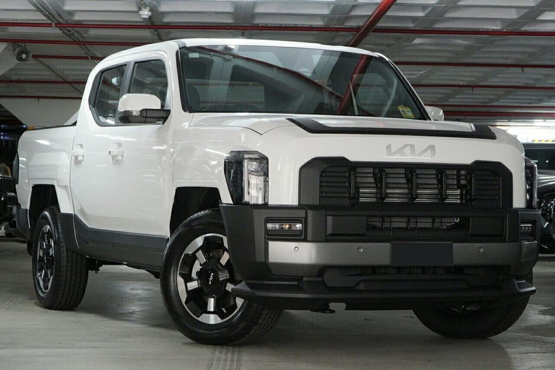 Front view of 2025 Kia Tasman SX+ TK 4x4 ute in white, showcasing rugged design and 4WD performance, available now at John Hughes Kia Victoria Park WA&nbsp;&nbsp;