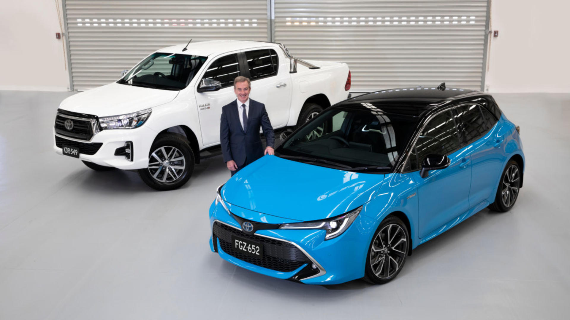 President and CEO of Toyota Motor Corporation Australia, Matthew Callachor, with Australia's top selling vehicle for 2019, the Toyota HiLux and Australia's top selling passenger vehicle, the Toyota Corolla