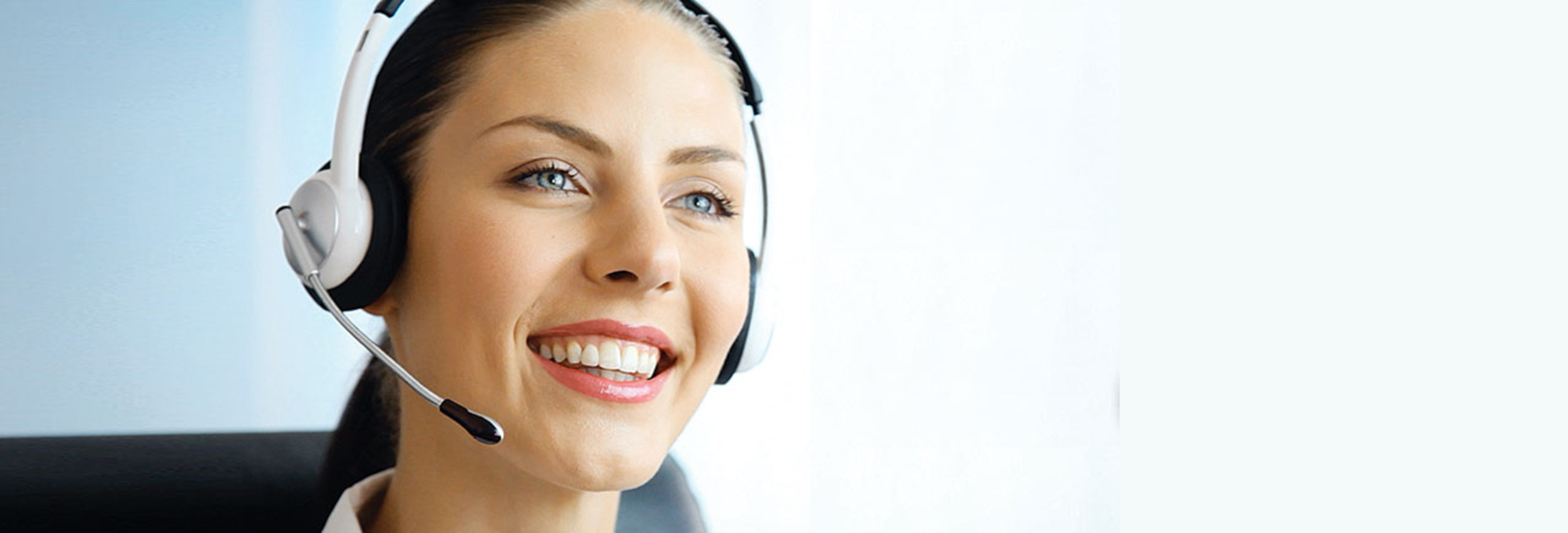 A HINO customer service representative standing with her arms crossed in front of a blurred background.