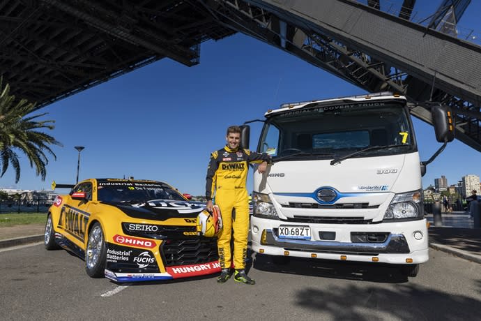 Anton DePasquale with his Team 18 #18 Chevrolet Camaro ZL1 and the Hino Hybrid Electric recovery vehicle.