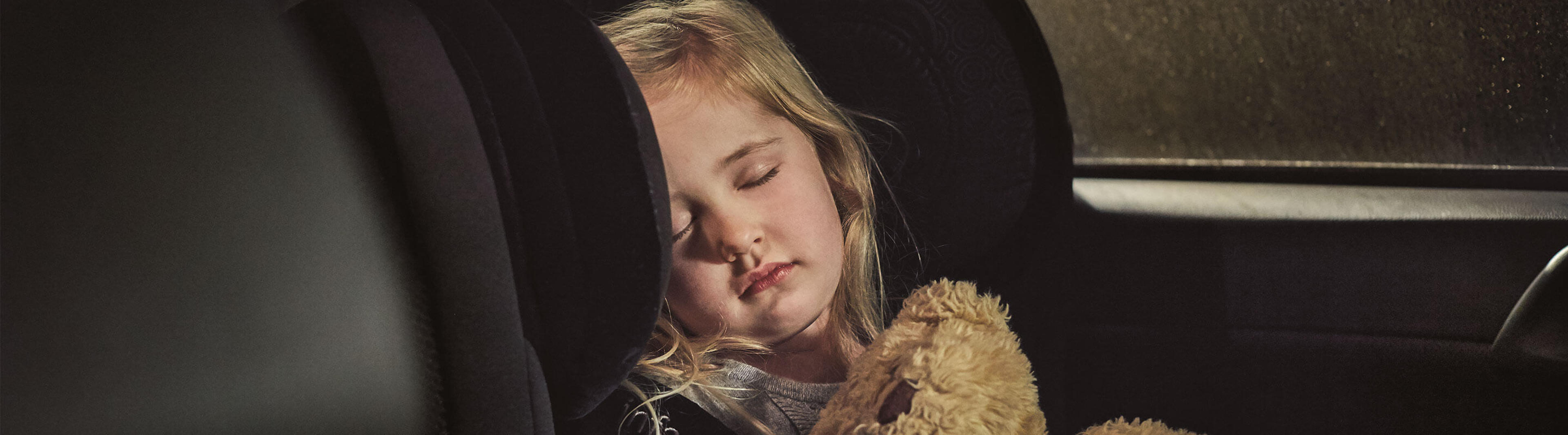 Girl sleeping in car seat