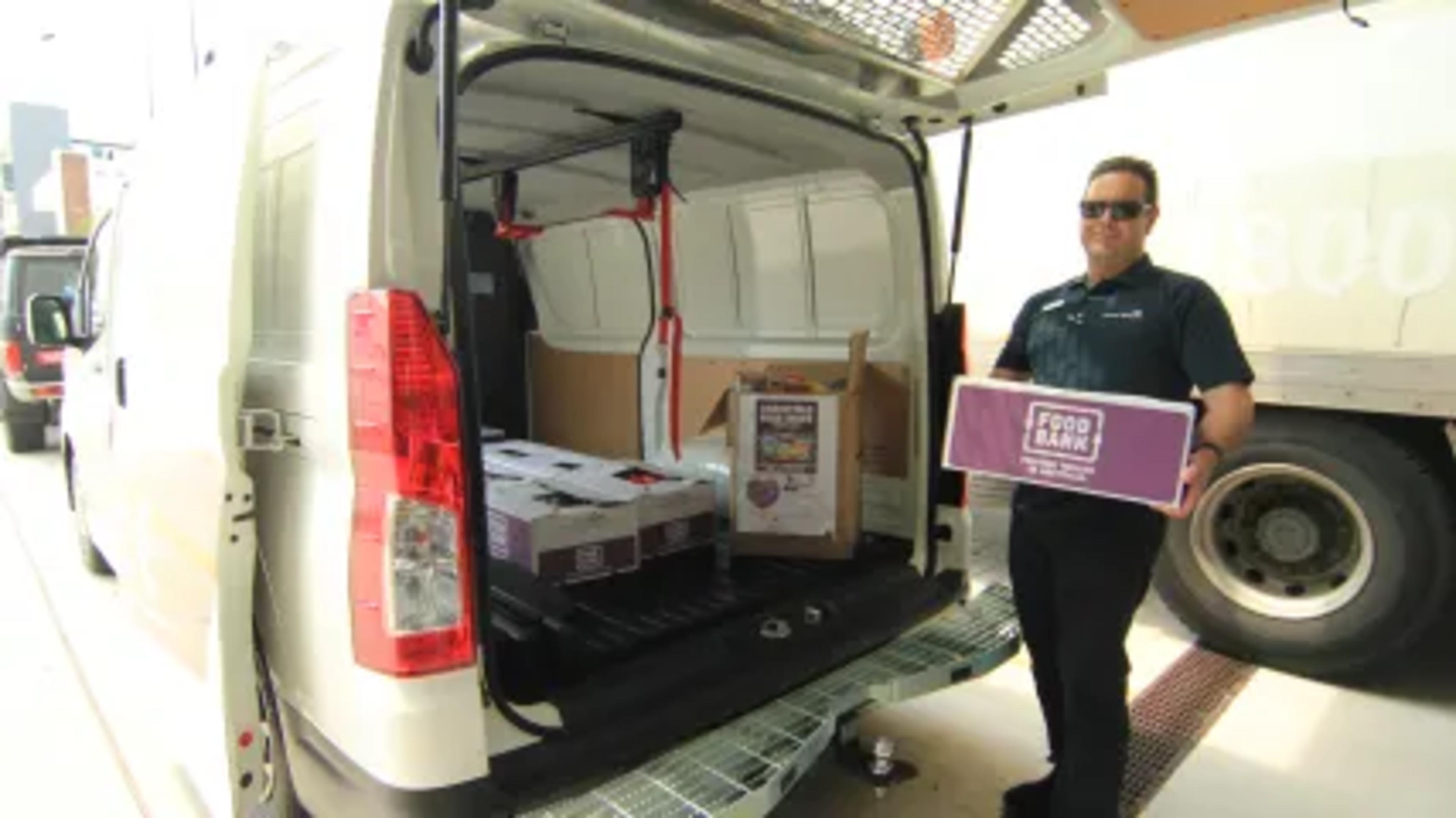 Motorama Toyota Moorooka GM Terry Beyer loading the first boxes at the Gold Coast University Hospital