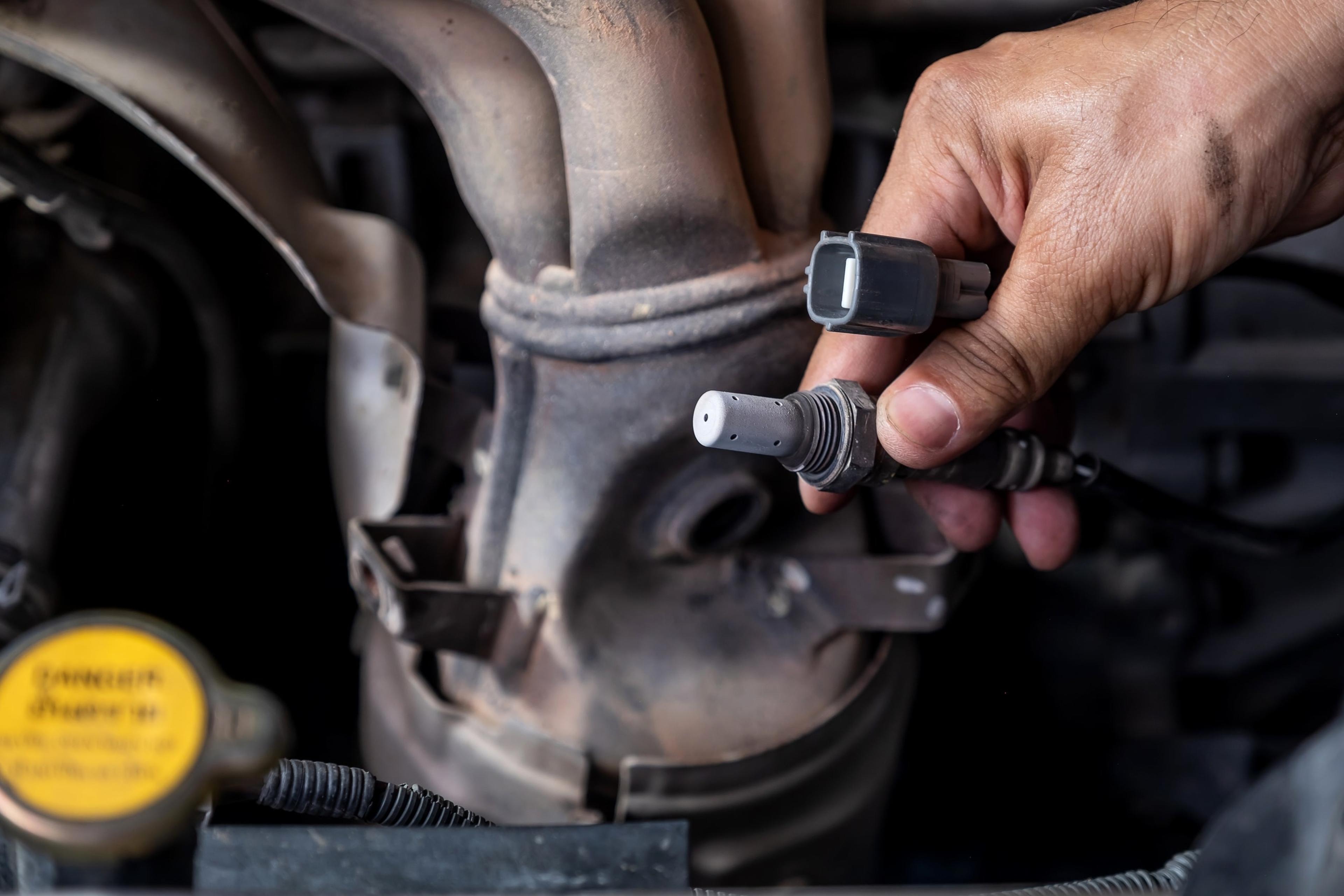 &nbsp; Mechanic removing oxygen sensor during check engine light diagnostics&nbsp;&nbsp;