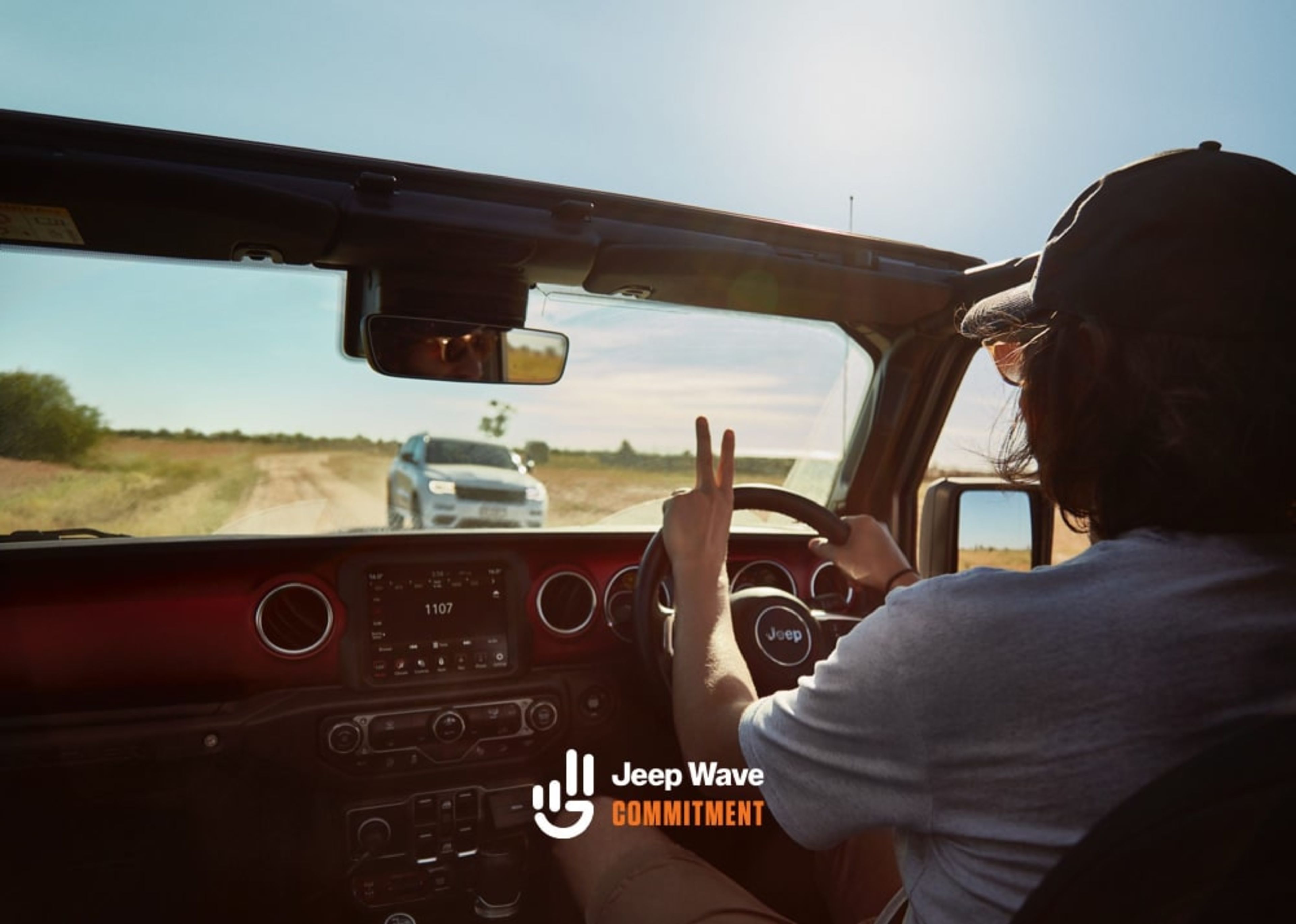 Person driving a Jeep on the beach