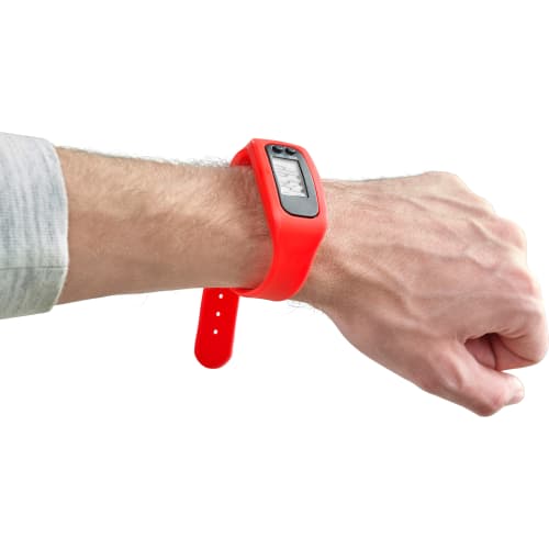 Silicone Wristband Pedometers in red on a hand by Total Merchandise