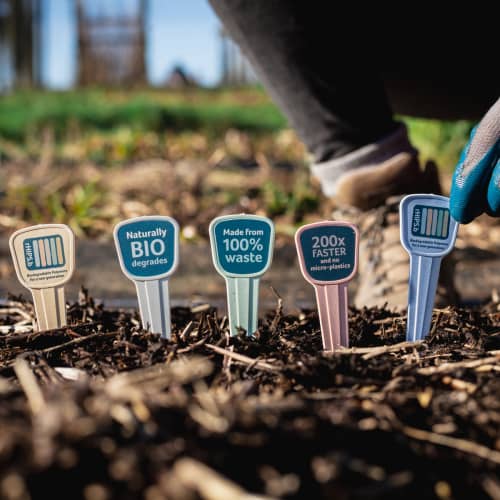 Recycled Biodegradable Plastic Plant Marker Kits planted in the ground by Total Merchandise