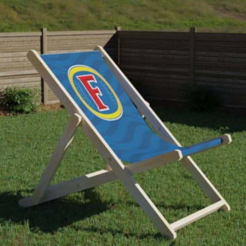 A lifestyle image of the Giant Deckchairs in Natural/White from Total Merchandise