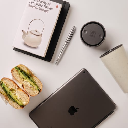 Lifestyle image of the Circular & Co 12oz Reusable Coffee Cup in Black from Total Merchandise