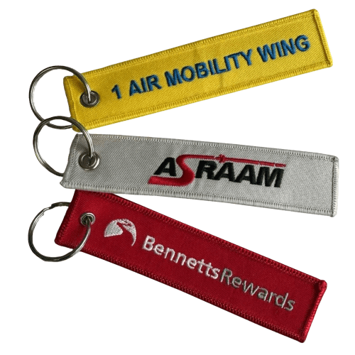 A lifestyle image of the Embroidered Keyrings with a range of different company logos