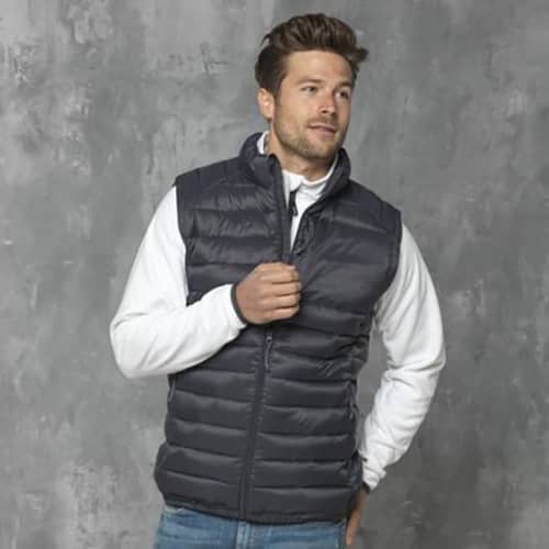 A lifestyle image of the Pallas Men's Insulated Bodywarmer in Storm Grey from Total Merchandise