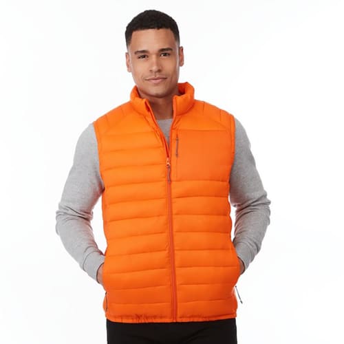 A lifestyle image of the Pallas Men's Insulated Bodywarmer in Orange from Total Merchandise