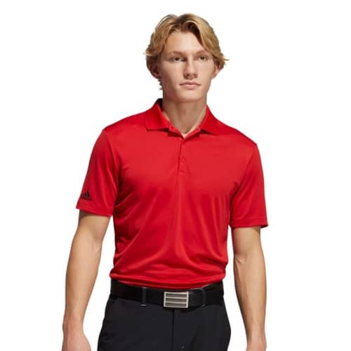 A lifestyle image of the Adidas Performance Polo Shirt in Collegiate Red from Total Merchandise