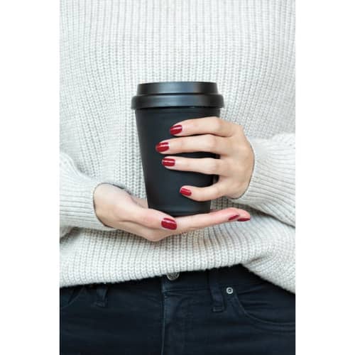 Lifestyle image of the Reusable DOuble Walled Coffee Cup with a printed design from Total Merchandise